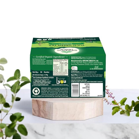 Green tea packaging with focus on fresh, natural leaves for a healthy drink.